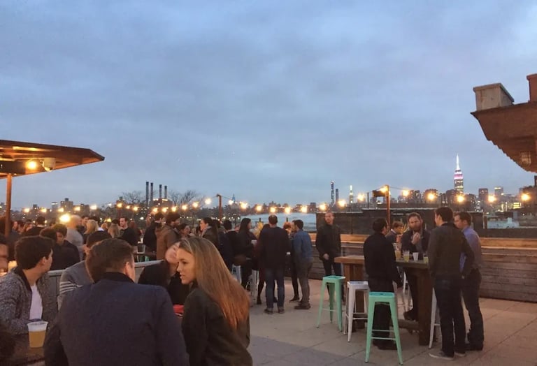 People engaged in thoughtful conversation during a curated intellectual event