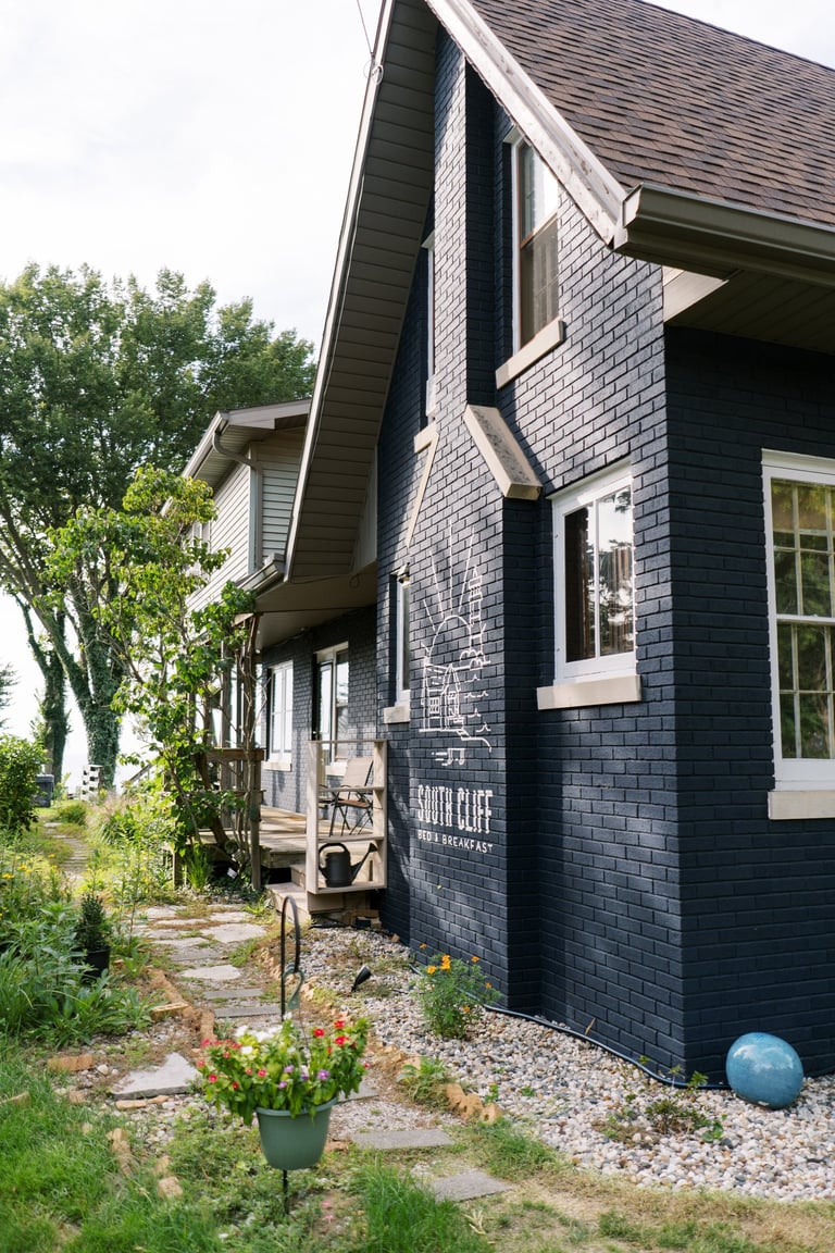 South Cliff Inn side yard with painted logo