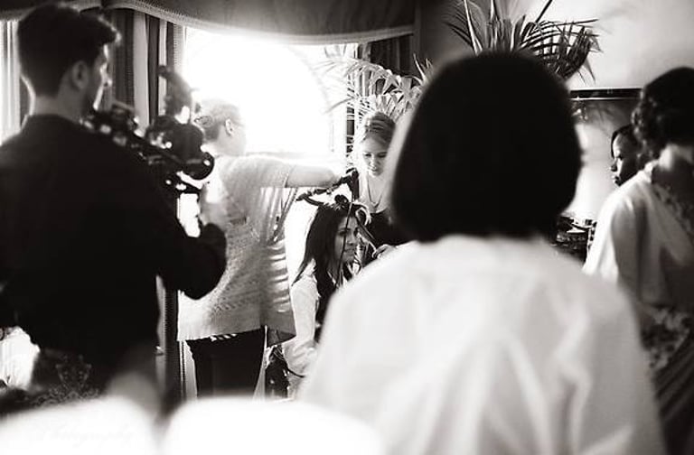 Makeup artist working on a bride