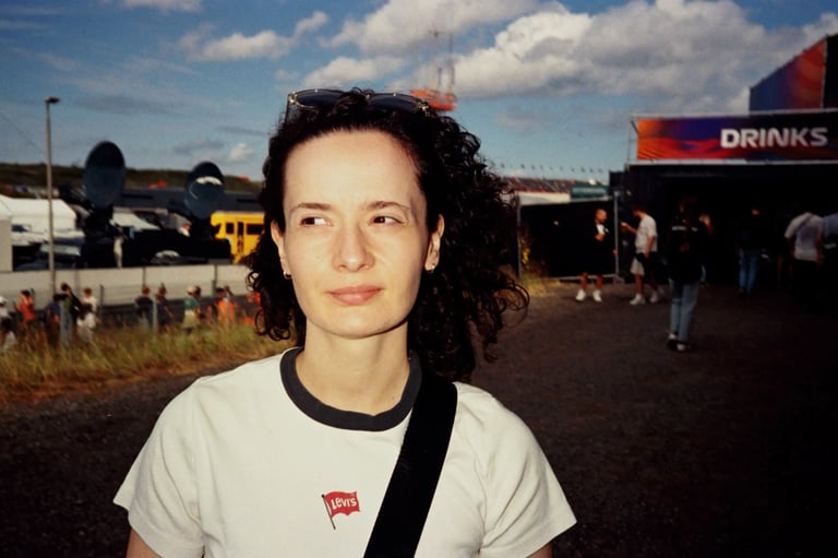 Portrait of a woman at the Zandvoort F1 circuit. Unedited 35mm film SOOC photography.