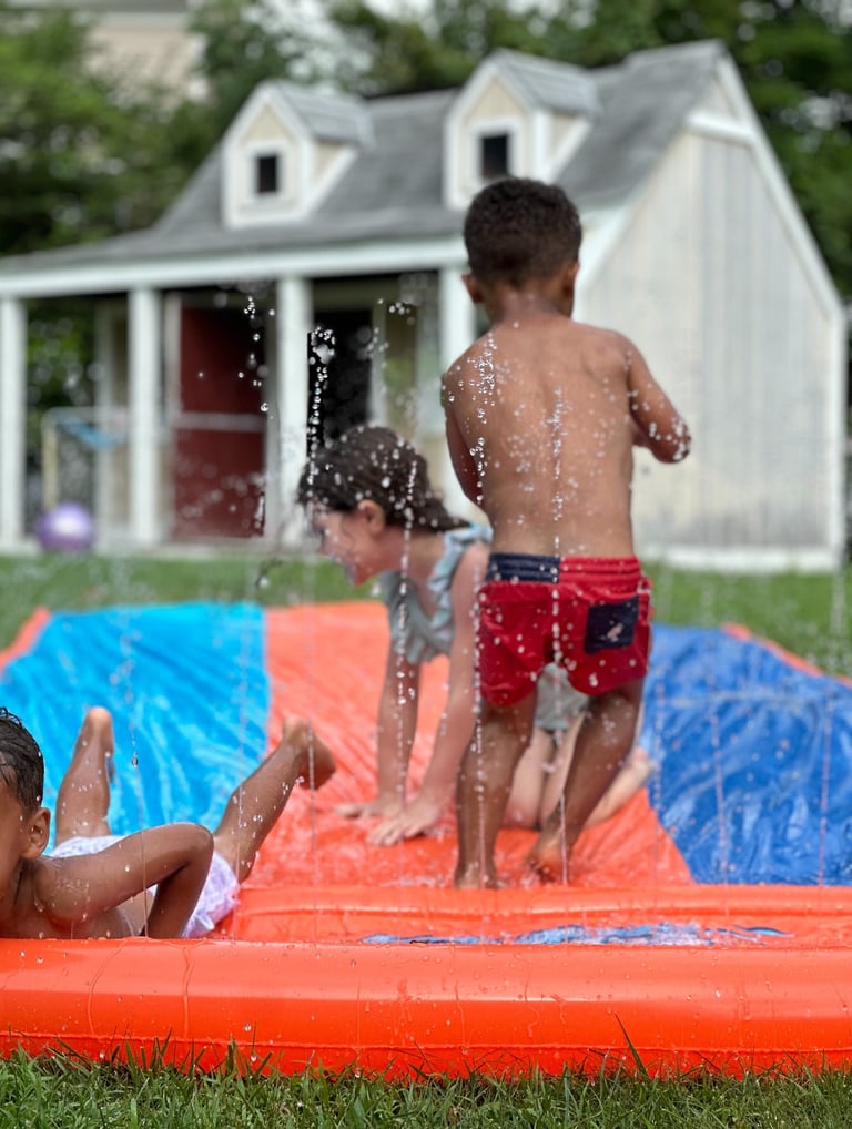 Kids Playing with Slip n Slide: Outdoor Play