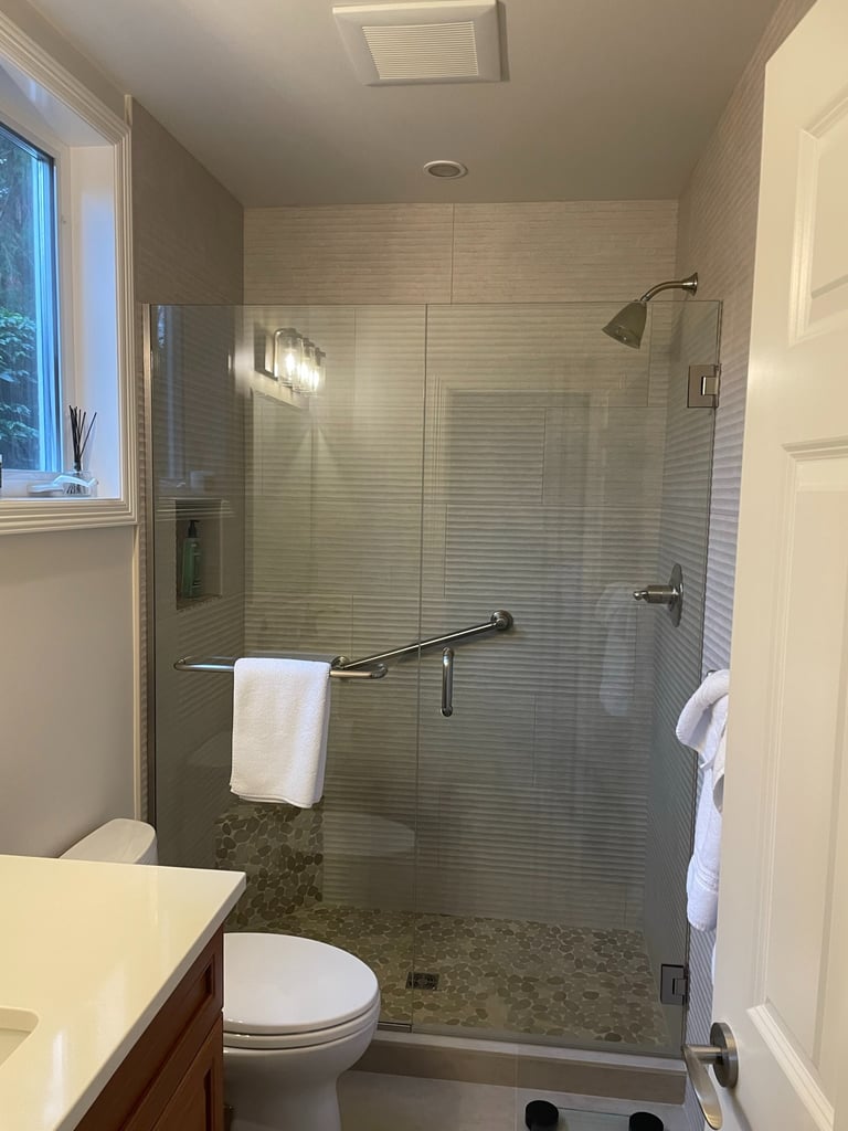 Beautifully-remodeled guest bathroom in Bellevue, WA - Tile Installation, Paint, Flooring, Cabinetry