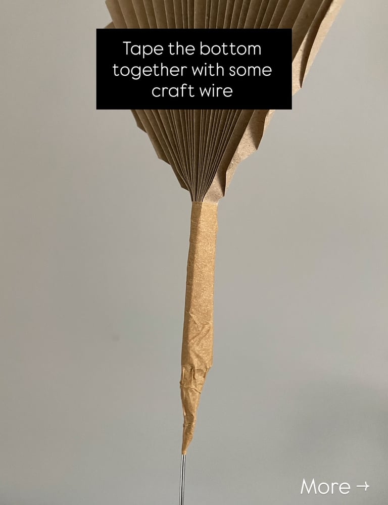 accordion-style folded flower petal for DIY lamp shade, taped with brown paper tape and wire