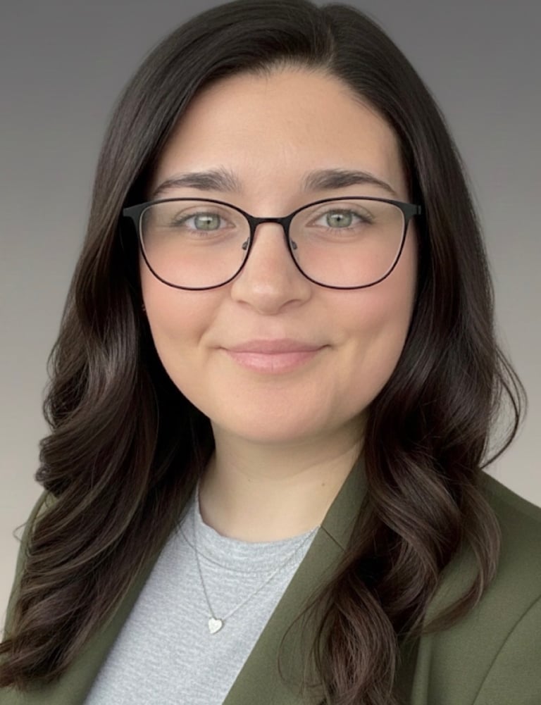 a woman in glasses and a green jacket