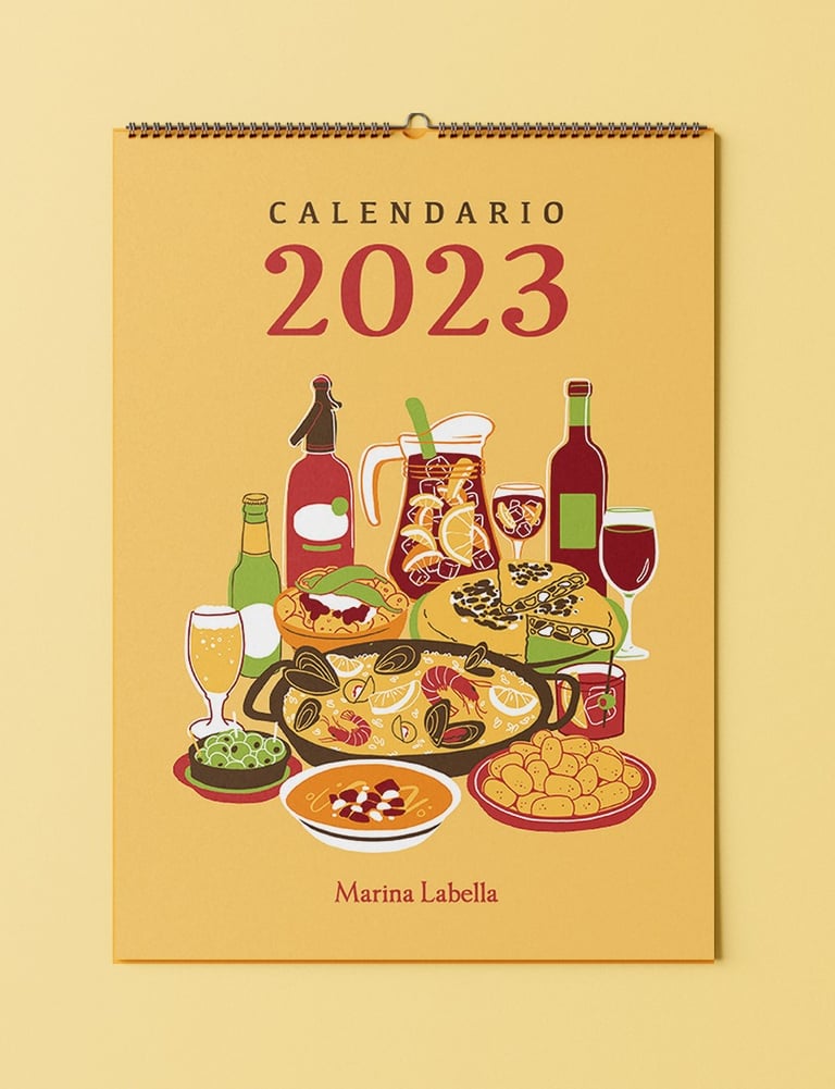 a 2023 calendar cover with food plates of Spanish gastronomy