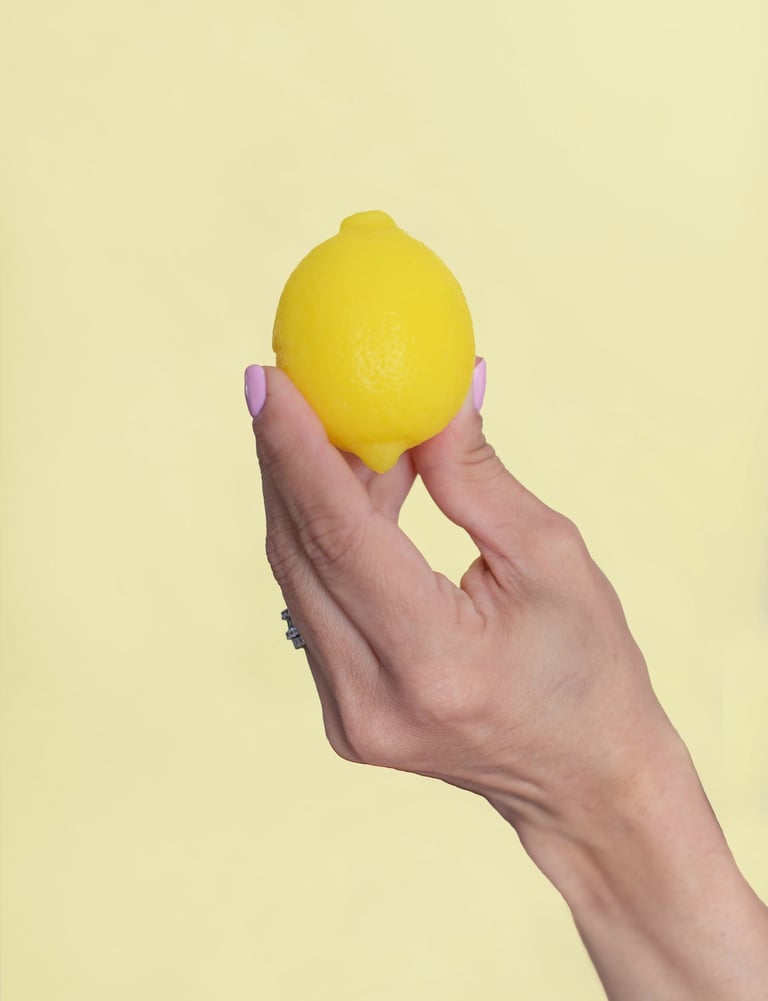 a person holding lemon soap