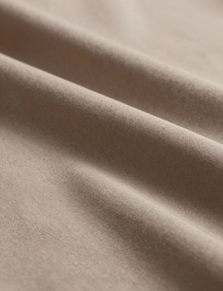 A high-resolution macro shot of a fabric texture in #3F5E5C, draped elegantly. The lighting creates deep shadows and bright highlights, emphasizing the material's quality and professional finish.