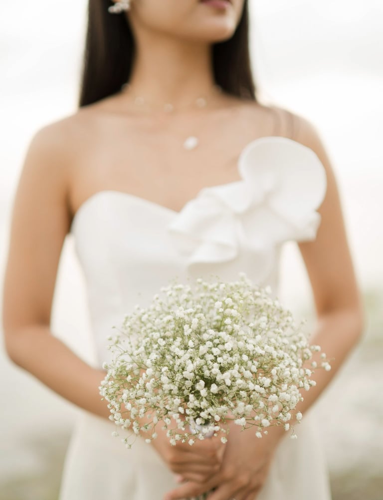 Bride portrait holding bouquet during sunset bridal session at Melasti Beach Bali