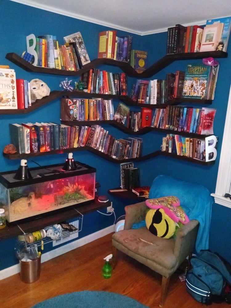 Floating shelves unit with multiple angles, filled with books