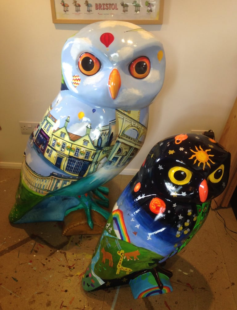 Two painted owls for Owls of Bath Sculpture trail, by Laura Fearn. Front