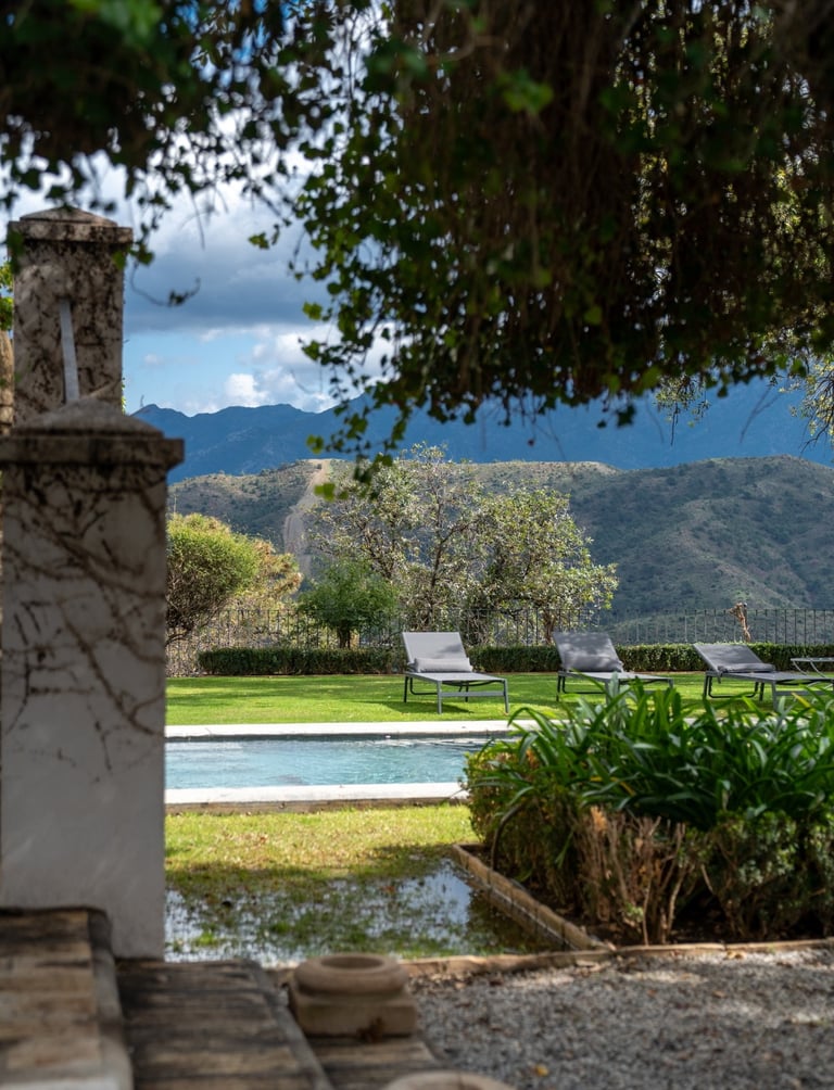 Beautiful pool surrounded by oak trees at Finca Santa Katerina