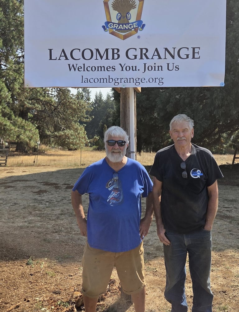 Brent and Art in front of the banner