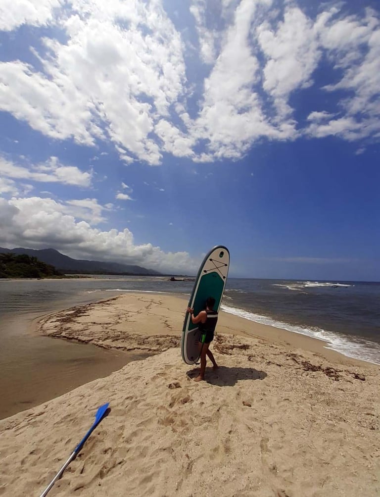 Paddle board at Don Diego River near Tayrona Park in Colombia