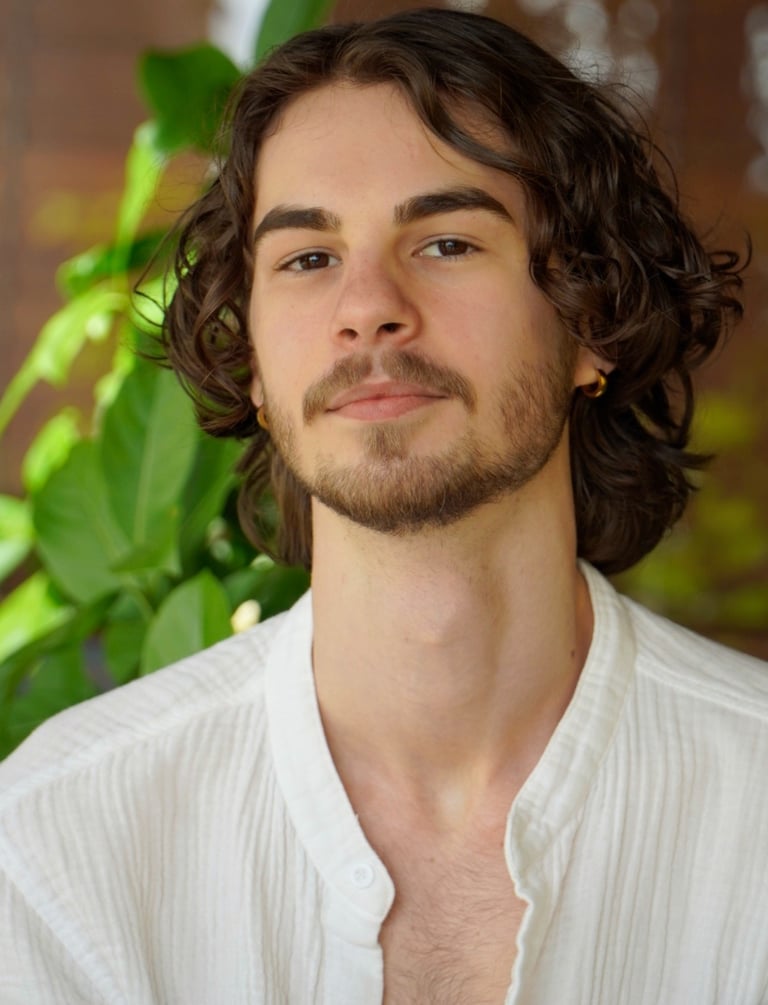 a man with a beard and a white shirt