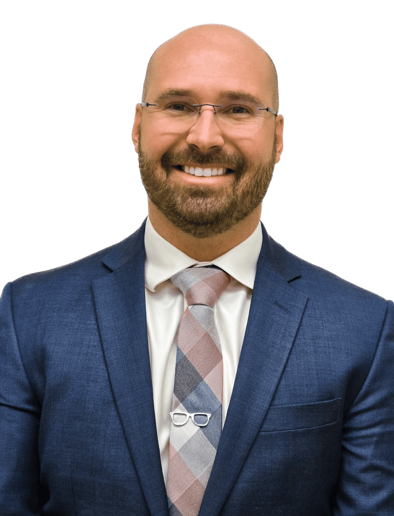 man wearing a suit and tie with glasses on