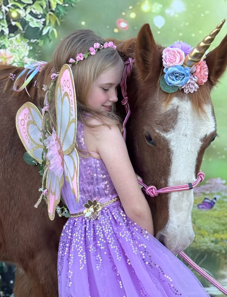 A fairy princess cuddles Snickers, the magical unicorn