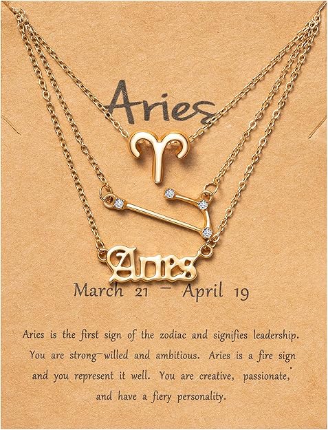 Aries gold layered necklace set featuring a zodiac symbol, constellation charm, and script nameplate.