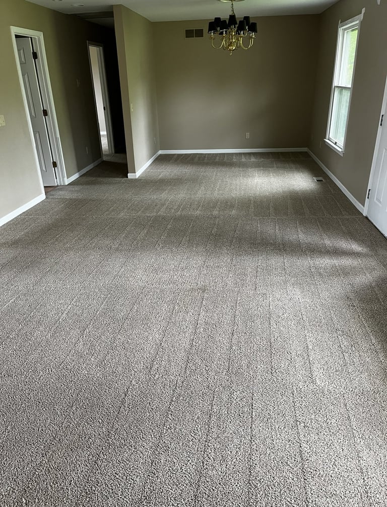Freshly cleaned residential carpet in living room by Steamaster Carpet Cleaning