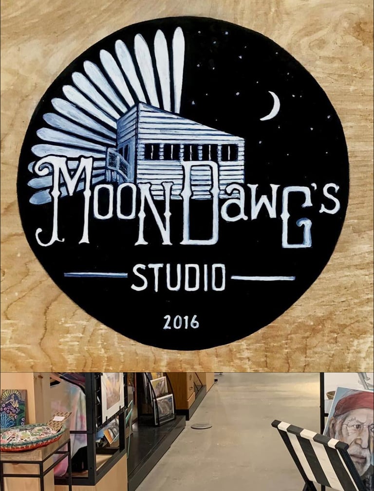 Hand-painted circular logo for Moon Dawg's Studio featuring a cabin under a crescent moon.