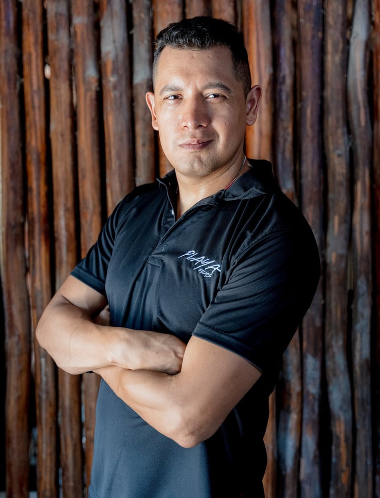 Alex Torres wearing a Playa Films t-shirt, representing the video production brand in Playa del Carm