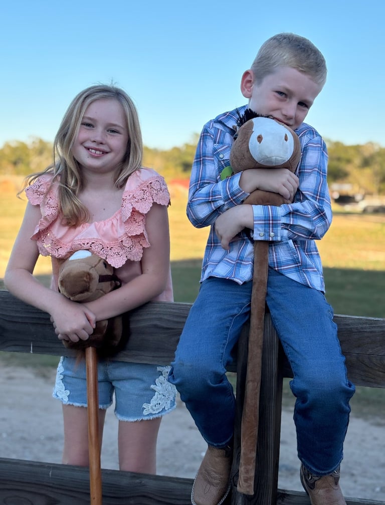 Kids waiting for their turn at the Stick Horse Rodeo game during a pony ride birthday party