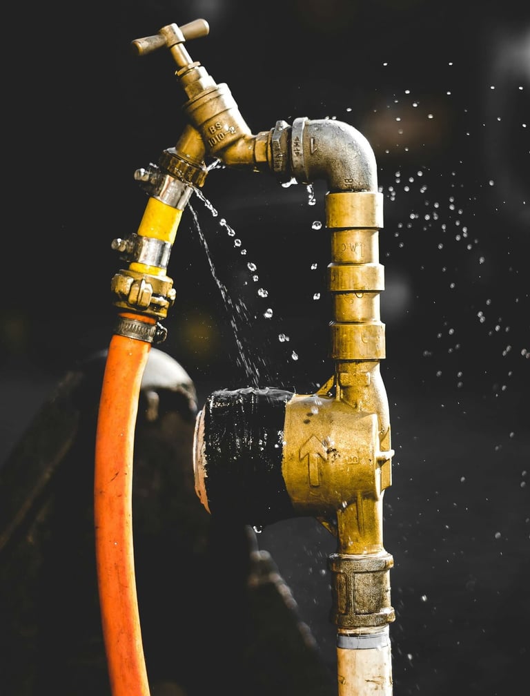 a hose faucet with water coming out of it