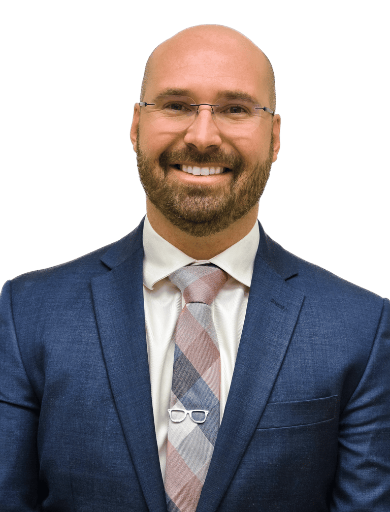 man in a suit with glasses wearing a tie