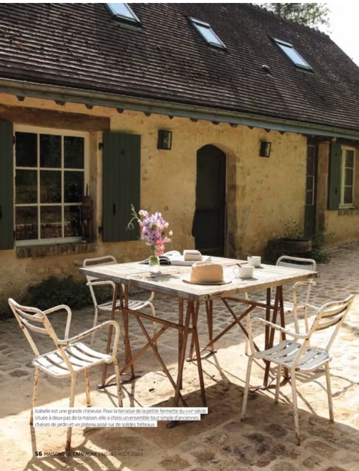 a table with a table set up outside, French countryside, normandy, cottage