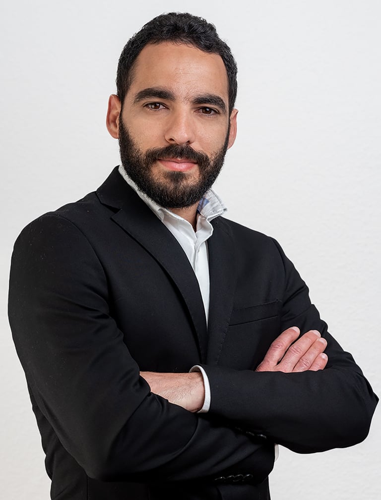 a man in a suit and a white shirt