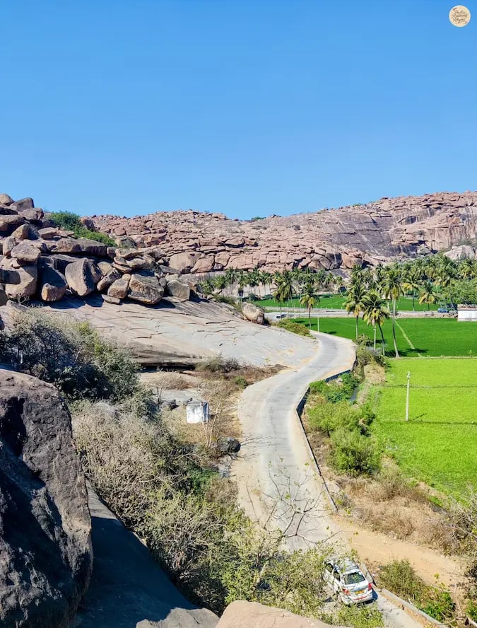 Scenic view of Kishkindha in Hampi, where rocky boulders blend with lush greenery.