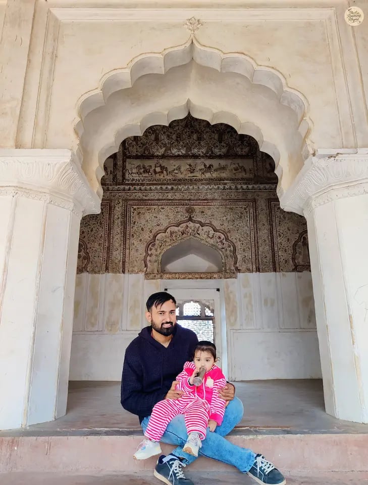A serene moment inside the fresco-filled chambers of Raja Mahal, Orchha.