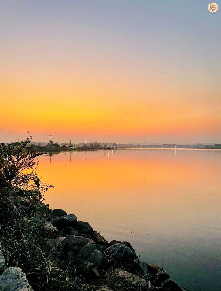 Sunset at Kamalapur Lake—Hampi’s sky blushed in pink serenity.