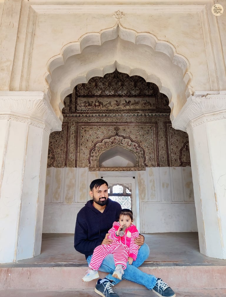 A quiet moment in the fresco-filled chambers of Raja Mahal, Orchha