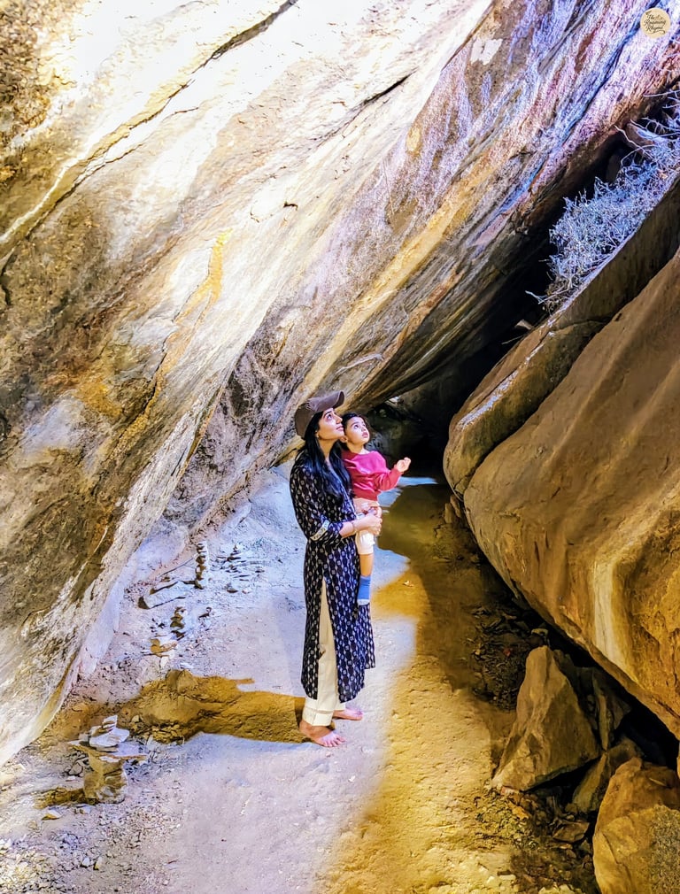 At Vali Cave in Hampi—mother and child tracing tales where legends once lived.