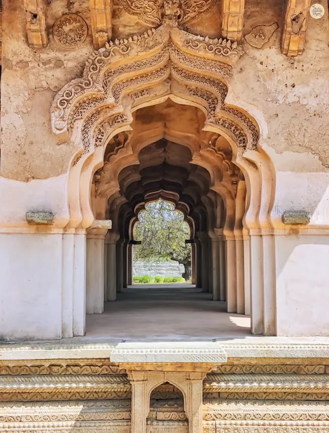 Lotus Mahal in Hampi with petal-shaped arches symbolizing timeless beauty.