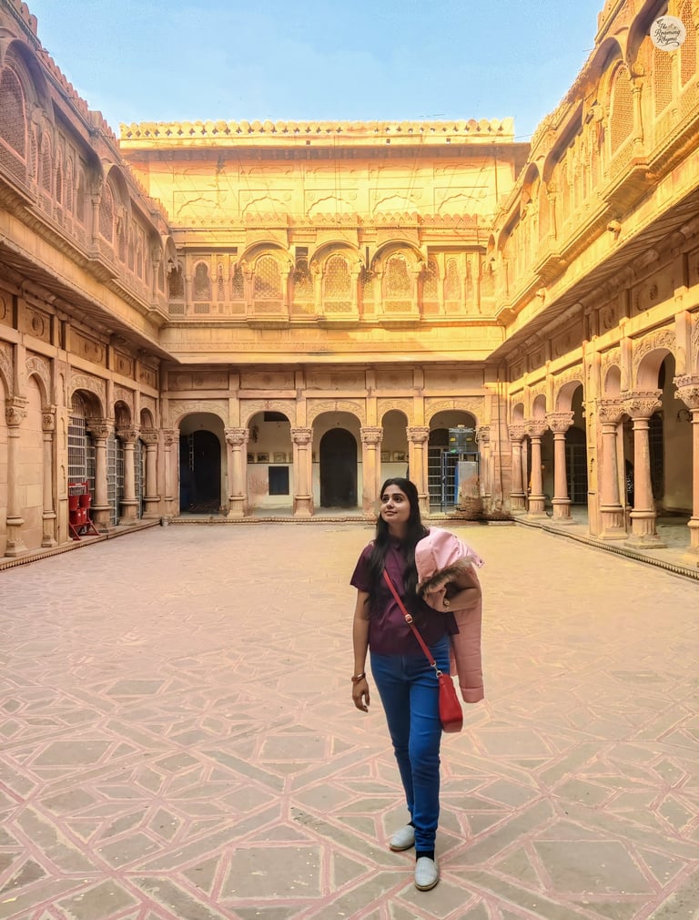 An open courtyard framing the calm beauty of Chandra Mahal