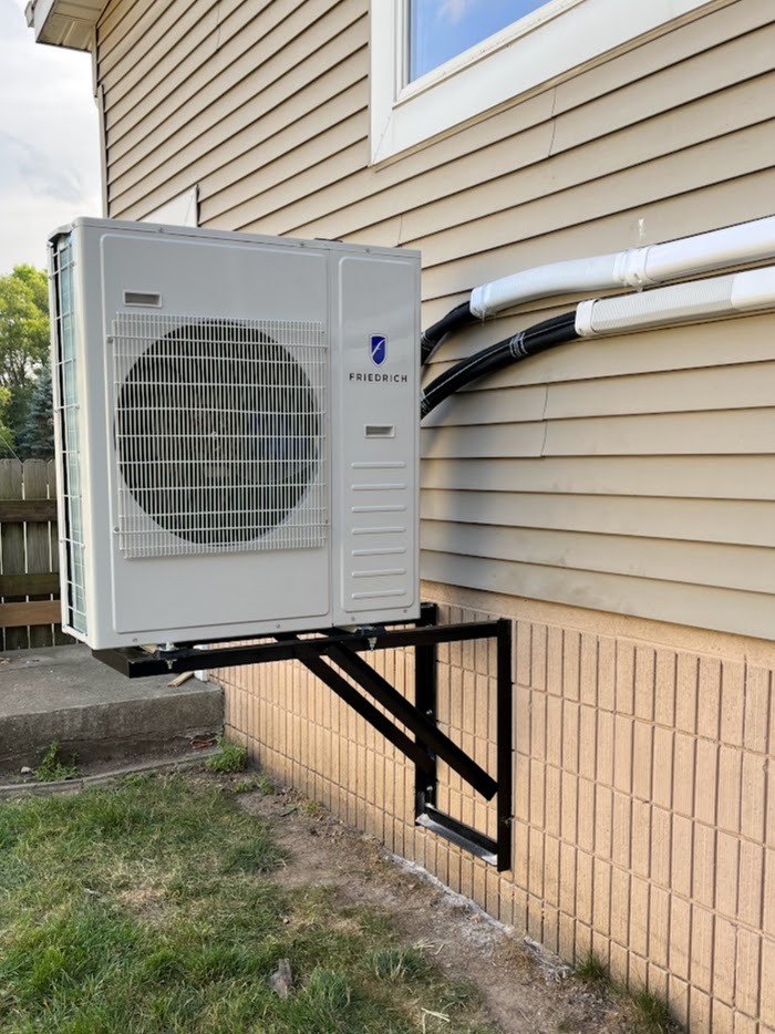 Mini split installed on a commercial building in West Bend, WI helps cool and heat classrooms.