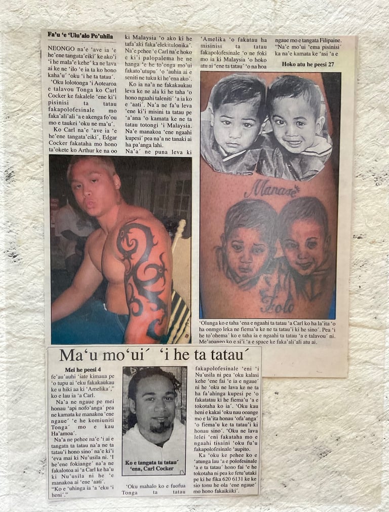 Carl Cocker on newspaper, Borneo tattoo, 2003
