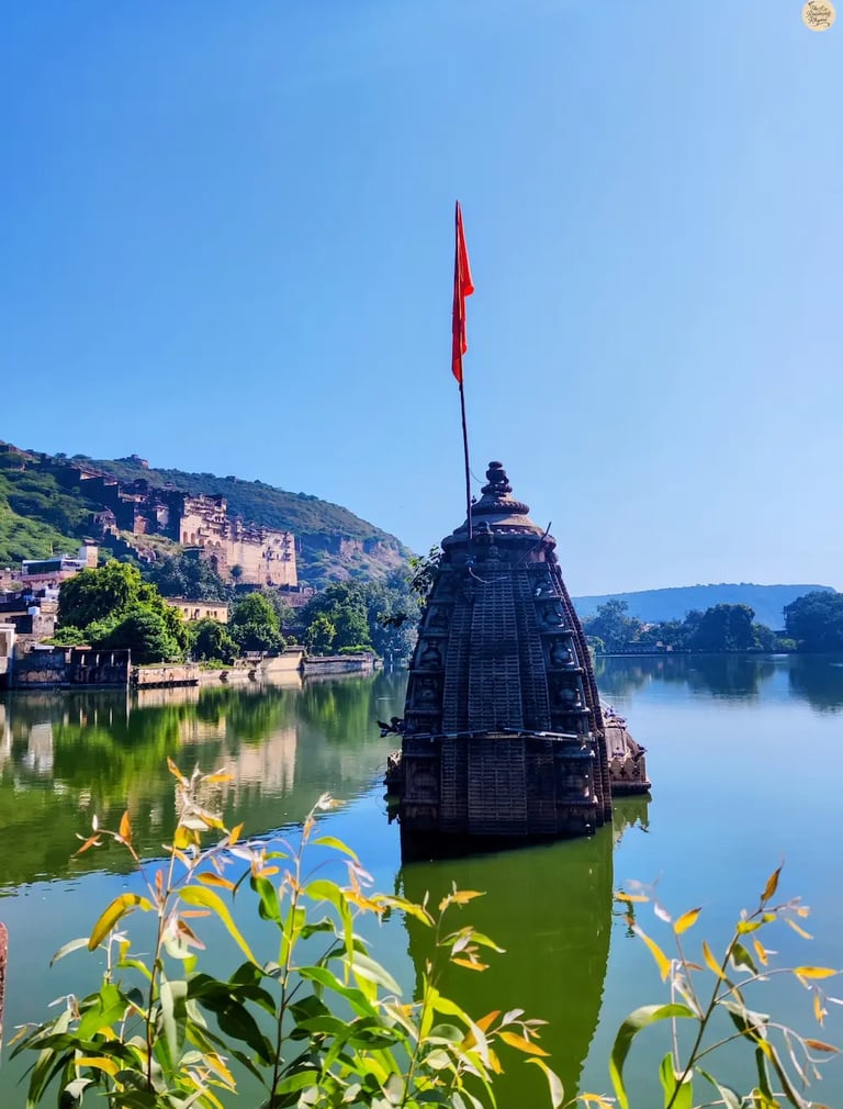 Half-submerged temple rising from the waters of Nawal Sagar Lake in Bundi, Rajasthan.