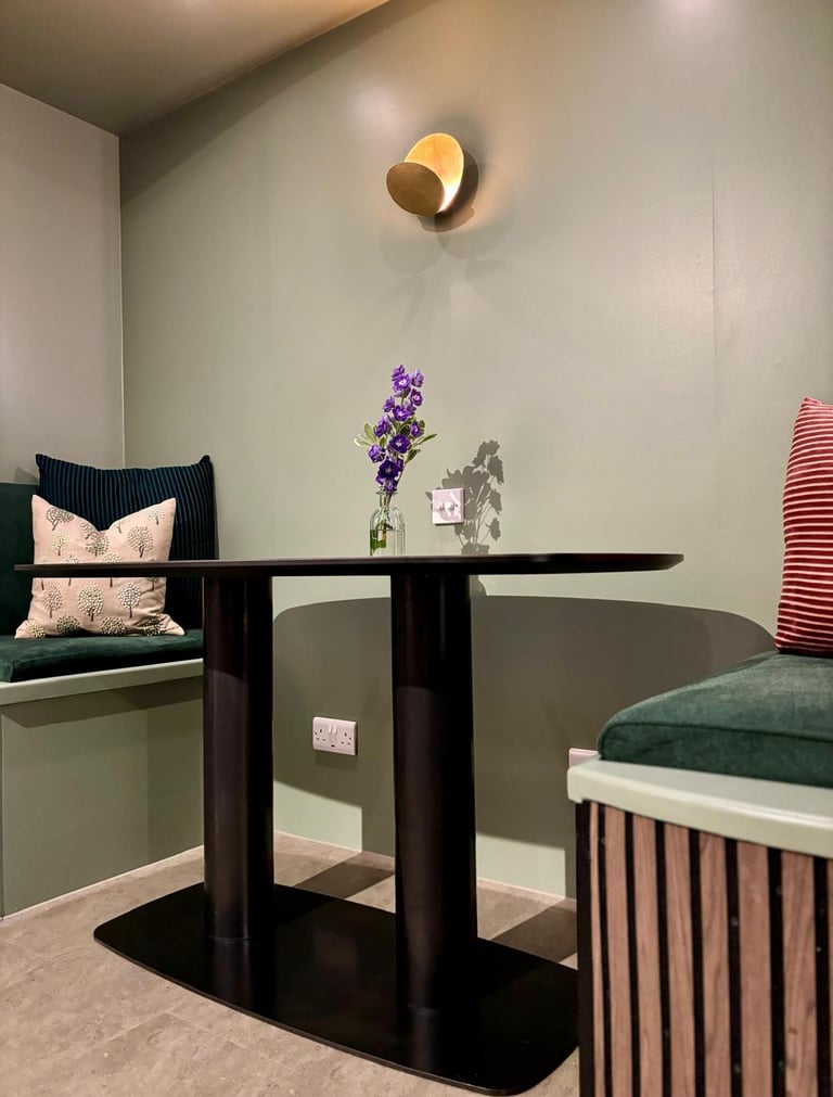 pods and bespoke table. wall light