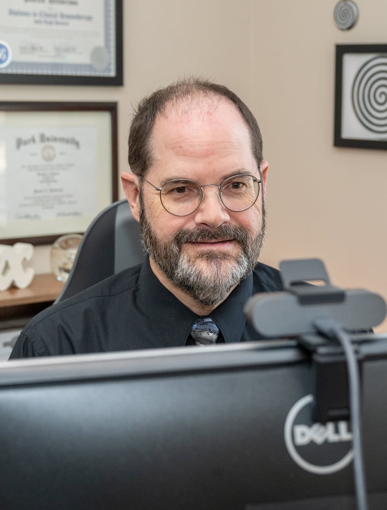 a man in a black shirt and tie dye dye dye dye dye dye dye dye