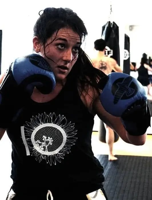 Veronica looking at a target as she prepares to throw a punch.