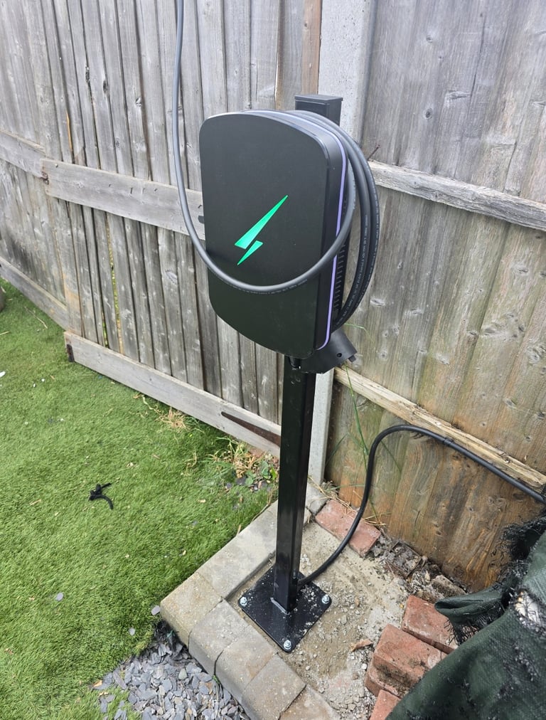 Post-mounted EV charger installed in a rear garden in Thurrock for charging a car parked outside the garden.