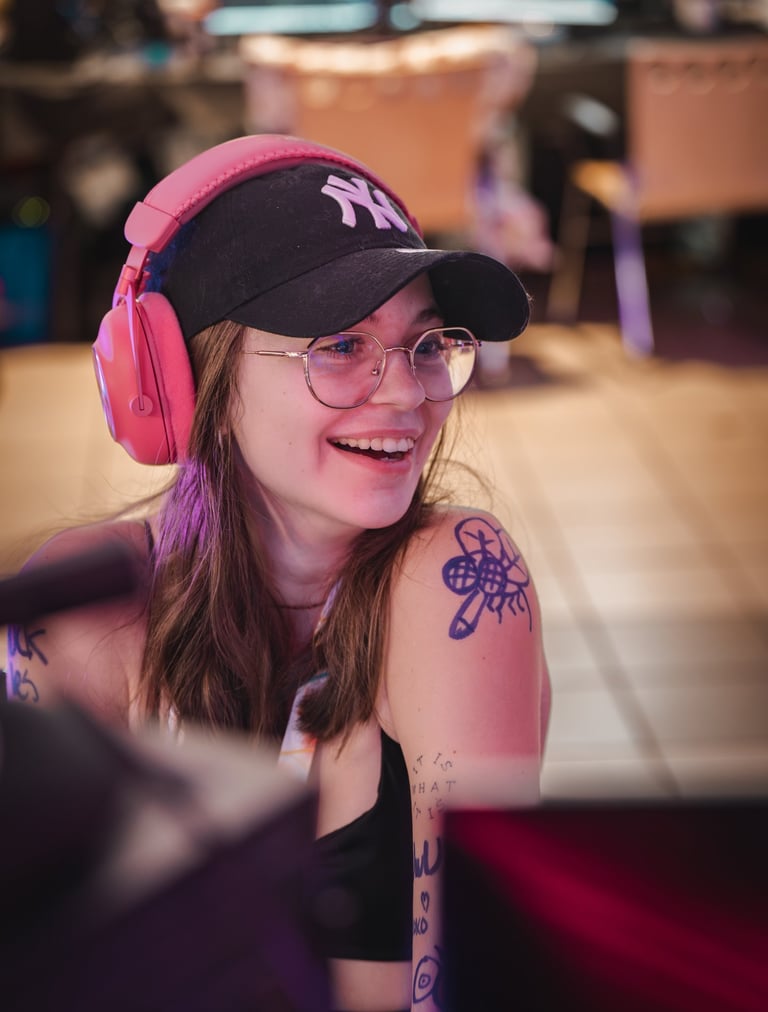 a woman with a baseball cap and headphones