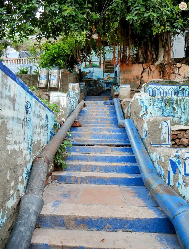 Blue Corridor stairs decorated with Rajasthani wall art, leading up to Pachetia Hill viewpoint, Jodhpur