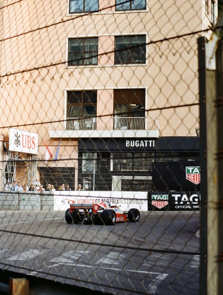 80's Formula 1 car going through La Rascasse corner in Monaco