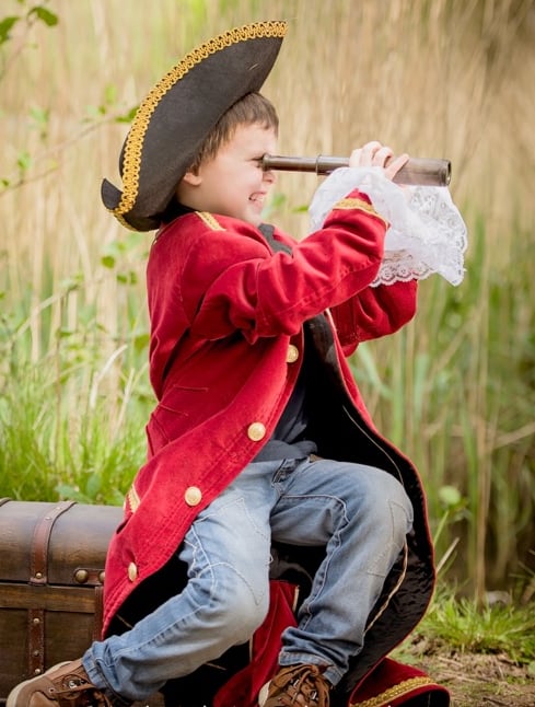Young boy dressed as a pirate for storytelling photography session