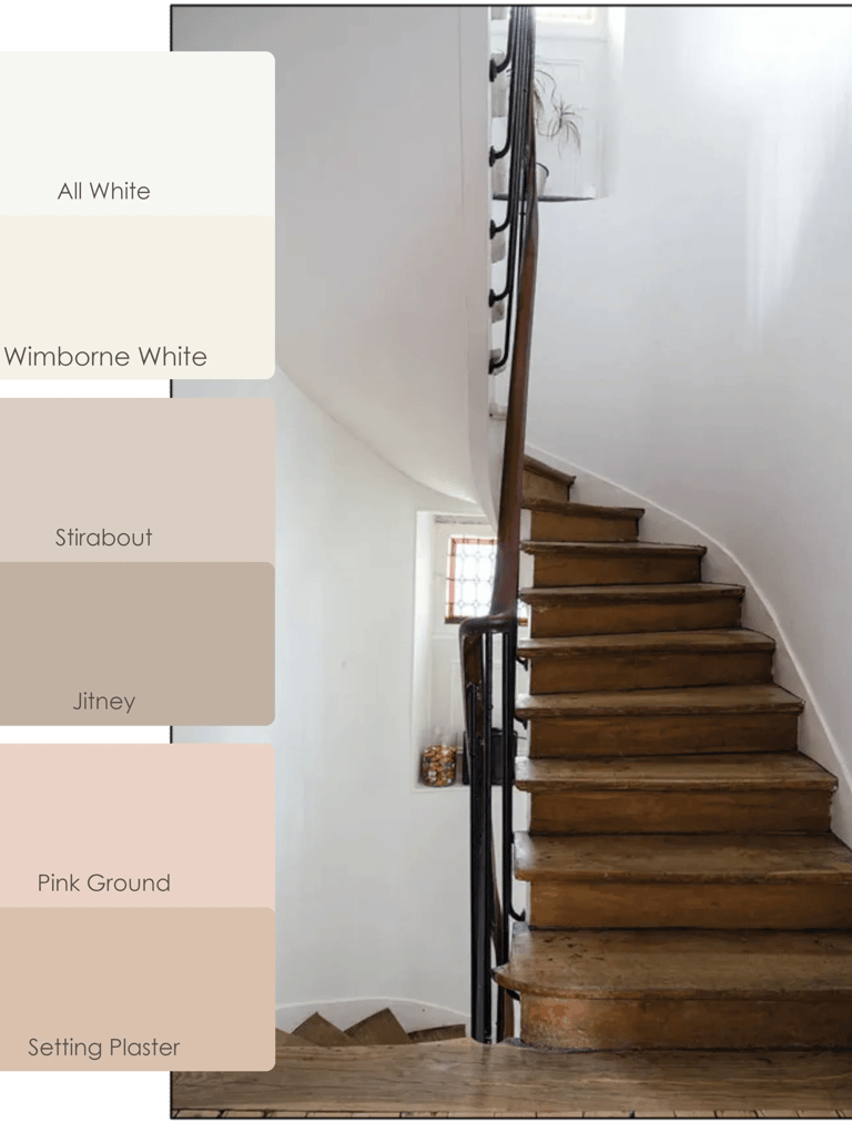 a staircase with a wooden staircase and a white wall