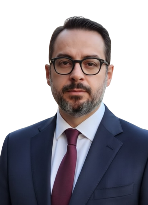 Professional portrait of a businessman wearing glasses and a navy suit with a burgundy tie.