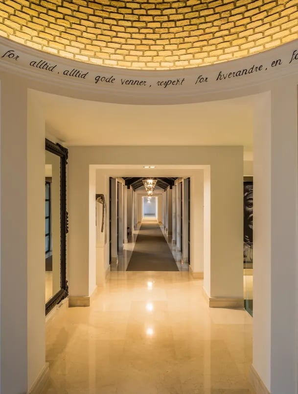 Golden-domed hallway with marble floors and symmetrical arches at Villa El Olivo, Marbella